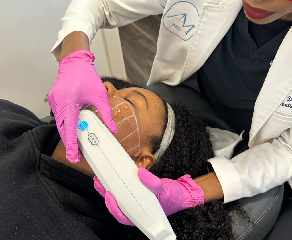 Provider performing an Ultherapy treatment on a patient