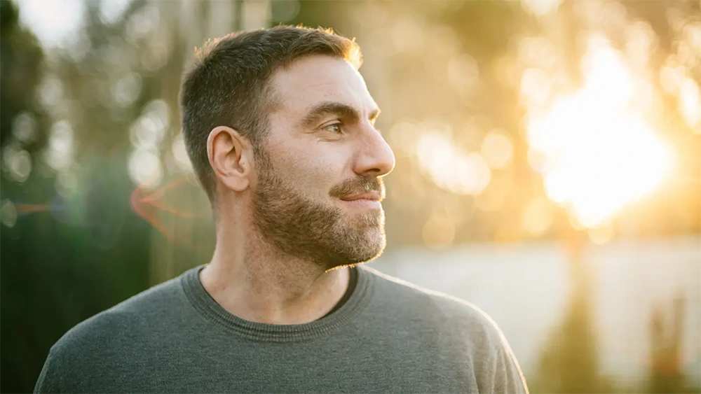Man looking outside for ketamine therapy content